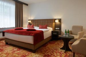 Posteľ alebo postele v izbe v ubytovaní Hotel Singer
