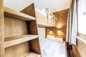 Postel nebo postele na pokoji v ubytování Residence Les Chalets du Forum - maeva Home