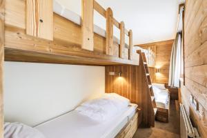Postel nebo postele na pokoji v ubytování Residence Les Chalets du Forum - maeva Home