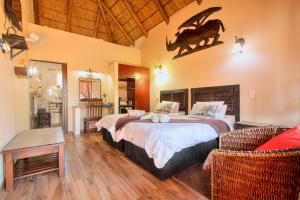 a bedroom with a bed with a dinosaur on the wall at All over Africa Guest house in Kempton Park