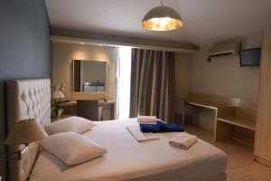 Posteľ alebo postele v izbe v ubytovaní Viaros Hotel Apartments