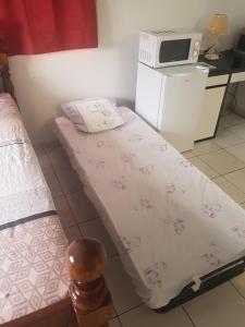 Una cama o camas en una habitación de MANIKOU
