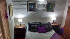 Ένα ή περισσότερα κρεβάτια σε δωμάτιο στο Qui Home +31 φωτογραφίες