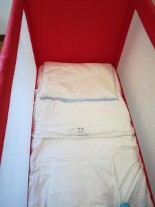 Voodi või voodid majutusasutuse Albergo Dei 10 Colori toas