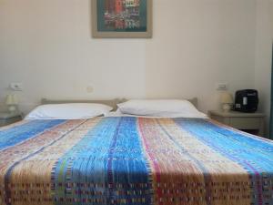 Voodi või voodid majutusasutuse Albergo Dei 10 Colori toas