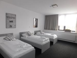 Postel nebo postele na pokoji v ubytování Penzion Nový Štěpánov