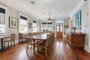 a dining room with a table and chairs at Elysian Fields Inn in New Orleans