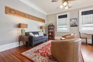 a living room with a couch and a chair at Elysian Fields Inn in New Orleans