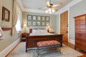 a bedroom with a bed and a ceiling fan at Elysian Fields Inn in New Orleans