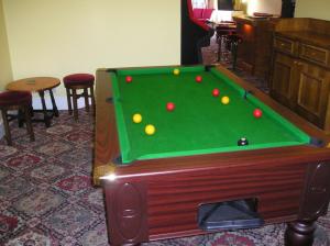 a pool table with balls on it in a room at The Belvedere in Blackpool