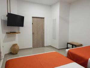 Postel nebo postele na pokoji v ubytování ETHNIC Thematic Hotel