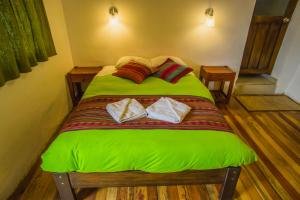 Postel nebo postele na pokoji v ubytování Tucan Hostel