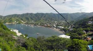 a view of a bay with boats in the water at Apartamento Mattos in Taganga