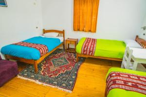 Postel nebo postele na pokoji v ubytování Tucan Hostel