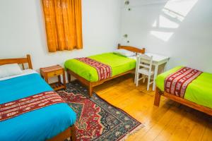 Postel nebo postele na pokoji v ubytování Tucan Hostel