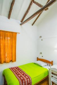 Postel nebo postele na pokoji v ubytování Tucan Hostel