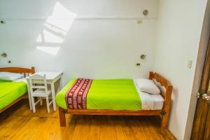 Postel nebo postele na pokoji v ubytování Tucan Hostel