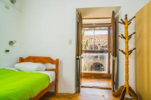 Postel nebo postele na pokoji v ubytování Tucan Hostel