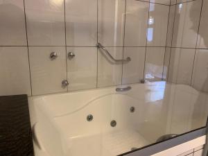 Ванная комната в Bellagio Mini Resort - no coração de Gramado