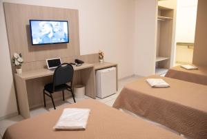 Postel nebo postele na pokoji v ubytování Getúllio Hotel + 36 fotografií