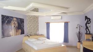 Postel nebo postele na pokoji v ubytování L'acqua Motel Express