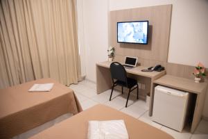 TV a/nebo společenská místnost v ubytování Getúllio Hotel