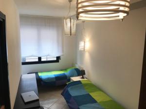 מיטה או מיטות בחדר ב-Rimini Centro Storico