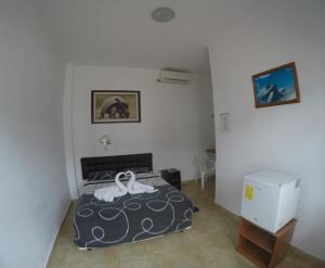 Rúm í herbergi á Stefany's Lodging
