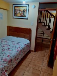 Postel nebo postele na pokoji v ubytování Hostal kuntur cusco
