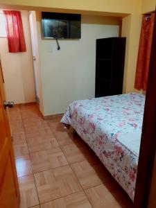 Postel nebo postele na pokoji v ubytování Hostal kuntur cusco