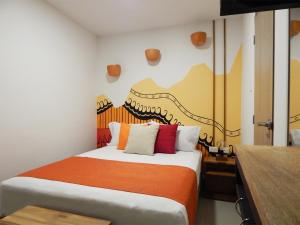 Postel nebo postele na pokoji v ubytování ETHNIC Thematic Hotel