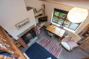 an overhead view of a living room with a table and a fireplace at Old Coach House - "Loved staying here" in Sheffield