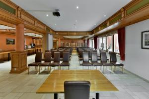 a conference room with chairs and a long table in a room at Hotel Belle Vue in Vianden +37 photos
