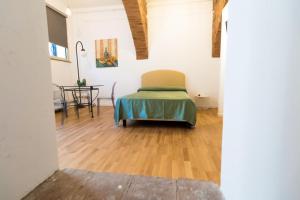 Posteľ alebo postele v izbe v ubytovaní Nerello Suites and Rooms