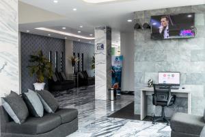 TV a/nebo společenská místnost v ubytování Hotel 5 Inn Plus