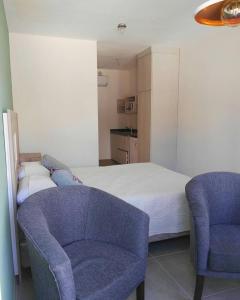 
A bed or beds in a room at Complejo Lisandro
