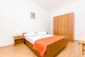 Postel nebo postele na pokoji v ubytování Apartments Mate