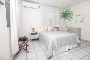 Postel nebo postele na pokoji v ubytování Beach House Rincon