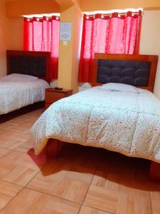 Postel nebo postele na pokoji v ubytování Hostal kuntur cusco