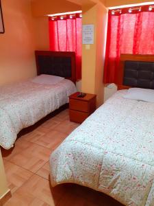 Postel nebo postele na pokoji v ubytování Hostal kuntur cusco