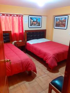 Postel nebo postele na pokoji v ubytování Hostal kuntur cusco