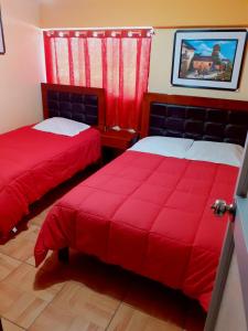 Postel nebo postele na pokoji v ubytování Hostal kuntur cusco