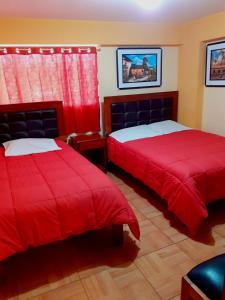 Postel nebo postele na pokoji v ubytování Hostal kuntur cusco