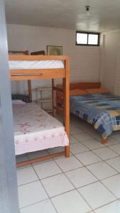 Postel nebo postele na pokoji v ubytování Casa Hospedaje Playas