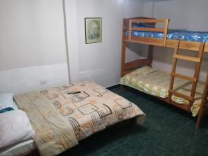 Postel nebo postele na pokoji v ubytování Casa Hospedaje Playas
