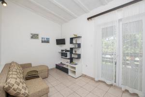 TV a/nebo společenská místnost v ubytování Apartments Mira