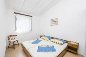 Postel nebo postele na pokoji v ubytování Apartments Mira