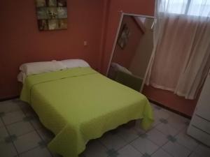 Postel nebo postele na pokoji v ubytování Casa Hospedaje Playas