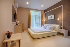 Ένα ή περισσότερα κρεβάτια σε δωμάτιο στο Hotel Ochagof