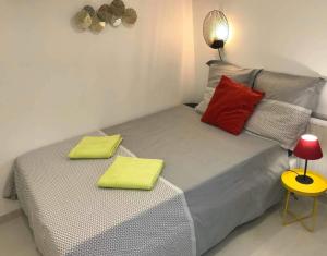 a bedroom with a bed with two pillows on it at Perfect Relaxation - Paris Antony in Antony
